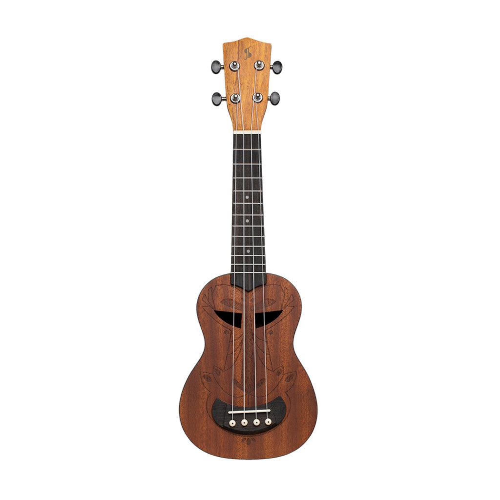 Wooden ukulele with a tiki face design on a white background